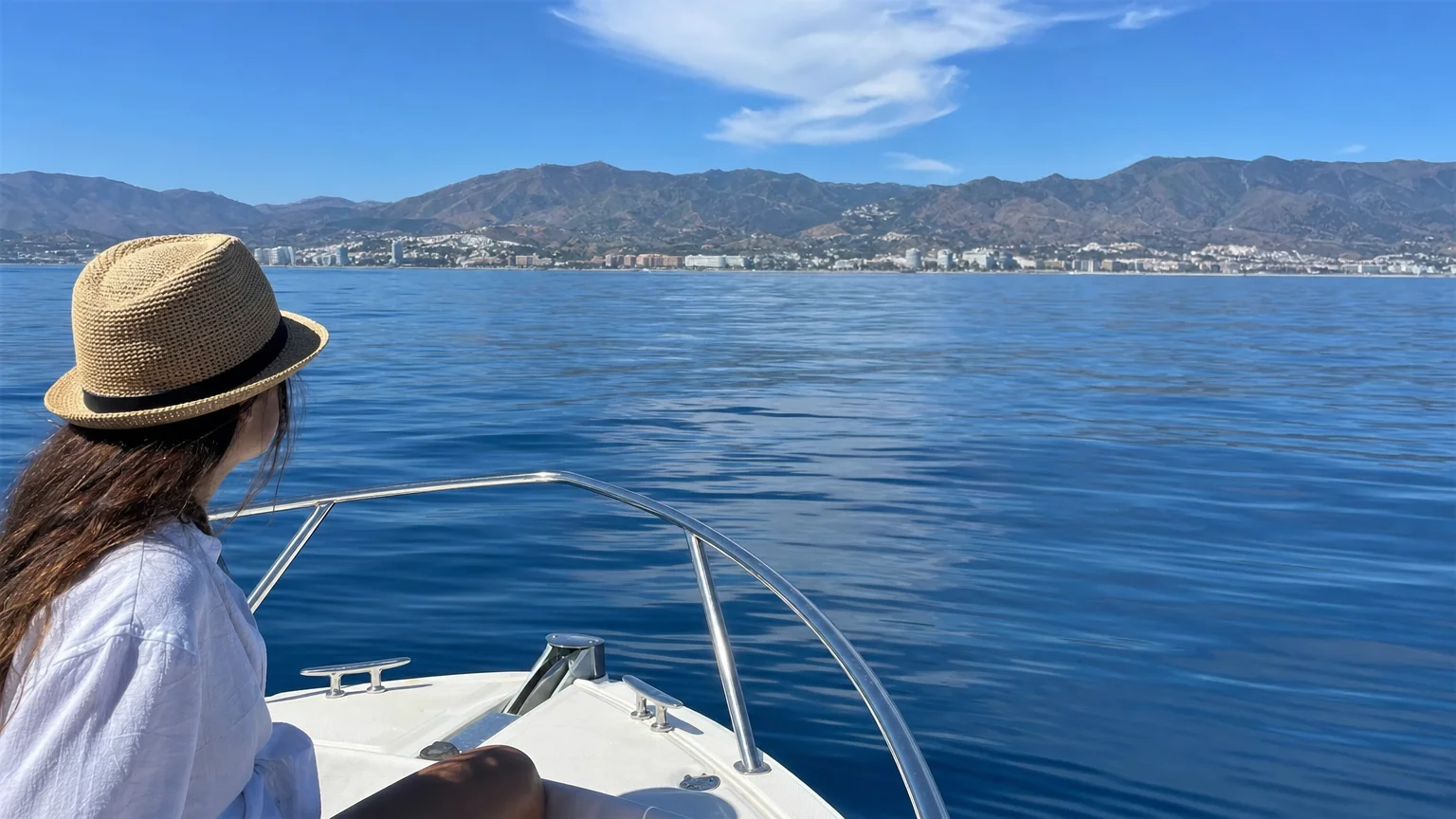 Boat sailing through calm Mediterranean waters off the Costa del Sol